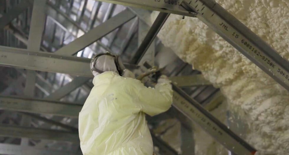 A Foam Insulation Company spraying insulation.