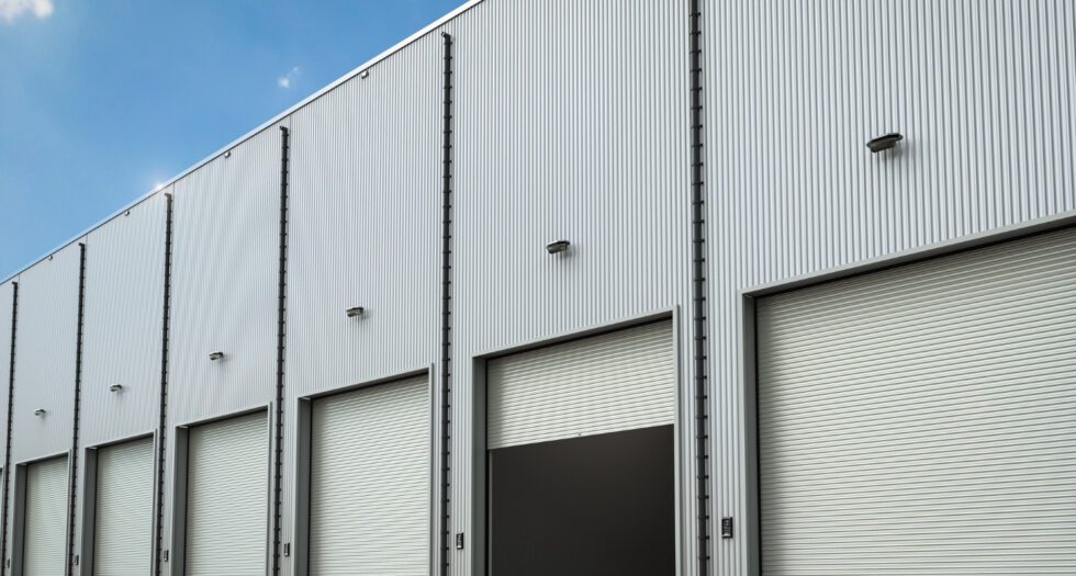 An exterior image of a large metal commercial building.